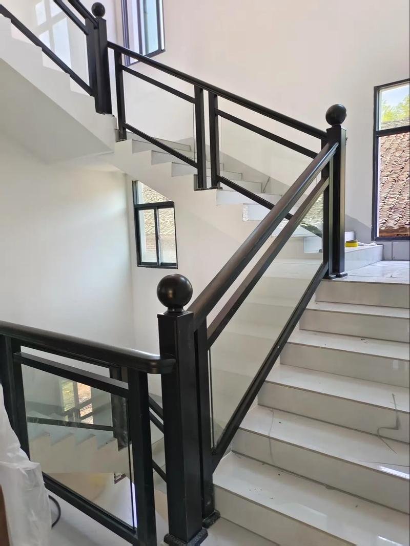 Black aluminium-framed glass partition and door for Uganda modern interiors Title: Black Aluminium Glass Partitions | Uganda Doors Interior